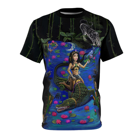 UNIQUE CENTRIC FINE ART BOUTIQUE JACOB'S LADDER BEAUTY AND THE BEAST, BEAUTY CONQUERS THE BEAST BY SHAKINAART. Experience the perfect blend of daring and style with this captivating KING t-shirt. Featuring a woman riding a crocodile, it's a symbol of fearlessness and individuality. Embrace your inner adventurer!