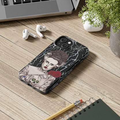 ELECTRIFY Those Around You with A Bride even the LIVING can be Bewitched By.... Let Them Stare at a Tough Phone Case that will Protect Your iPHONE Wherever GO!  Inspired by Universal Studios 1935 Film, The Bride of Frankenstein, starring Elsa Lanchester.   The Corpse Bride of Frankenstein was originally Brought to Life on Canson Paper, via the Mediums of Pen, Marker, Colored Pencil, and Acrylic Paint, by the then Blossoming Artistic Talent of Shakinaart when She was 16 years old.  SHAKINAART's Paintings are