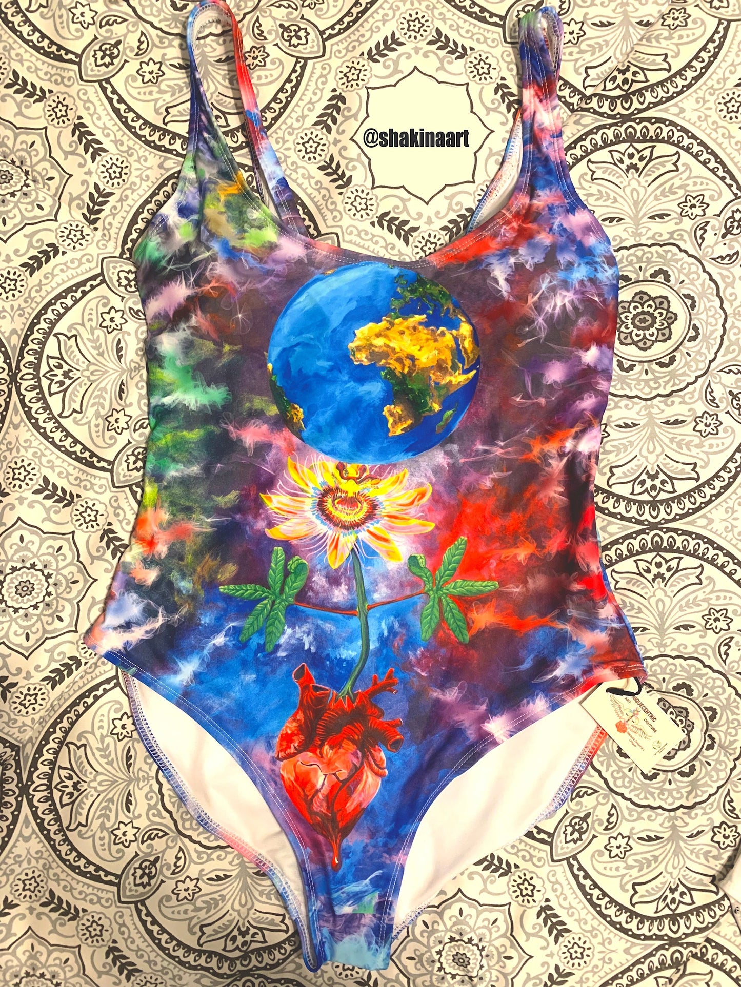 UNIQUE CENTRIC FINE ART COUTURE Rainbow Galaxy Rave Festival Earth Heart Queen Bodysuit. Dive into Summer & Capture the essence of love and adventure with this vibrant swimsuit WITH GALAXY RAINBOW BACKGROUND featuring Earth a PASSIONFLOWER AND A heart. Embrace your unique style and Express your love for our planet while looking stylish and confident. radiate positivity & make a statement by the poolside or at the beach! Earth day 2024 by shakinaart