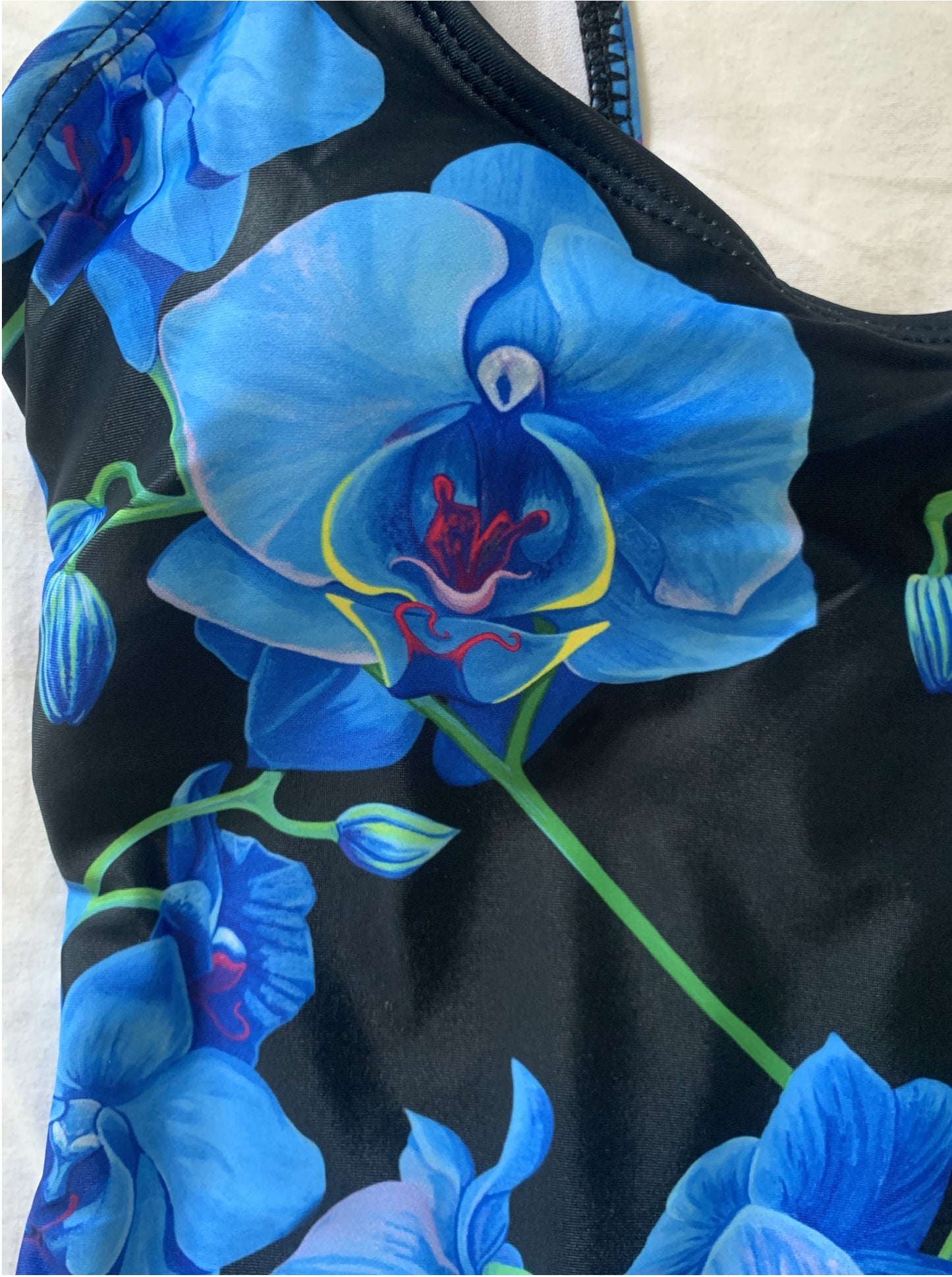 Dive into Summer with confidence & make a splash in this chic & stunningly gorgeous blue orchid one piece swimsuit. A great addition to your designer swimwear collection. Be Unique & Fabulous, while Embracing botanical elegance, beauty, grace and style at the pool party & beach! by SHAKINAART