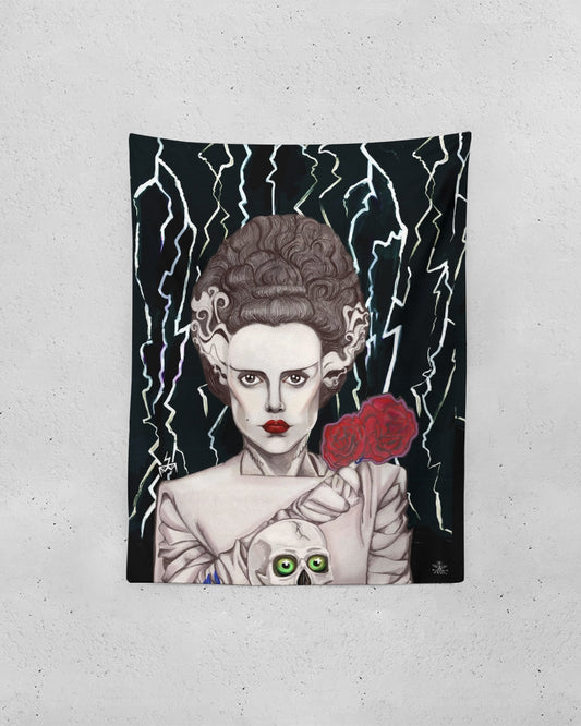 A tapestry with an image of a woman ELSE LANCHESTER BRIDE OF FRANKENSTEIN holding a rose AND SKULL THUNDER BOLTS.