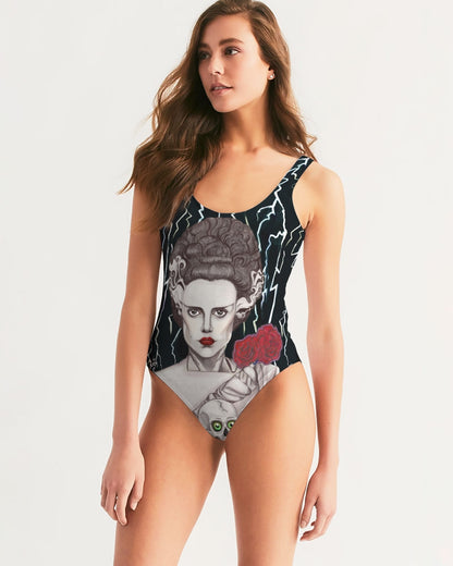 UNIQUE CENTRIC CORPSE BRIDE OF FRANKENSTEIN HALLOWEEN FINE ART QUEEN BODYSUIT - SHAKINAART Make a Splash with this stunning  rebel bride of frankenstein FINE ART swimsuit . At the pool party or beach rave festival this elsa lanchester bodysuit is fashionable edgy AND SEXY GOTH GIRL outfit staples. the one piece features a hand drawn bride OF FRANKENSTEIN  with skull and roses by shakina bell. Perfect for those who dare to defy tradition. Shop now!